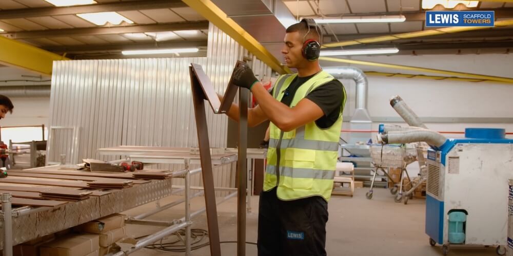 demonstrating folding toe-boards