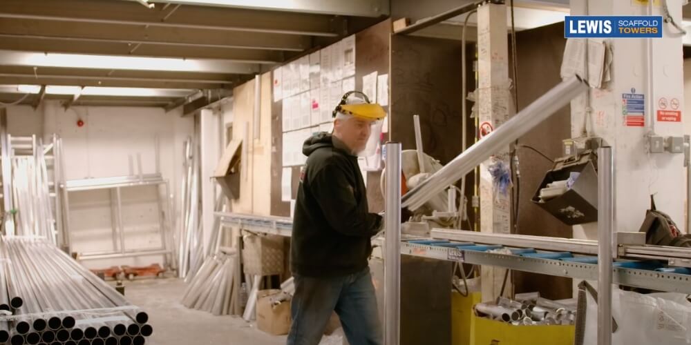 metal man cutting tubes for scaffold frames lewis